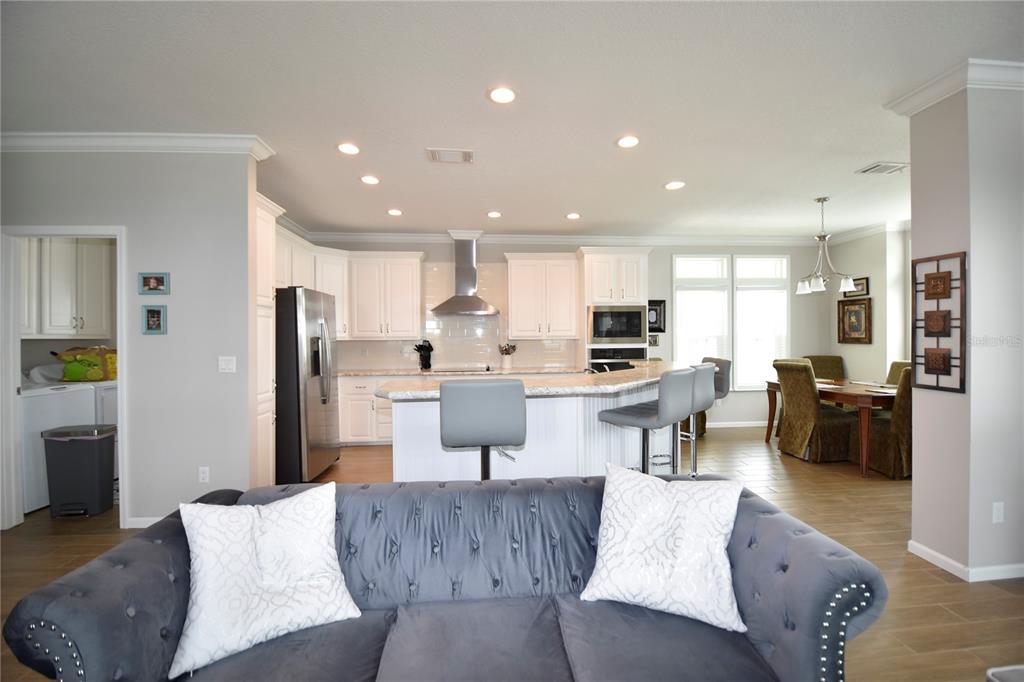4354 North Manatee Loop, Unit 16A Punta Gorda, FL 33980 - Photo 10 of 33 a living room with stainless steel appliances kitchen island granite countertop a couch and a view of kitchen