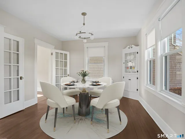 a view of a dining room with furniture window and wooden floor
