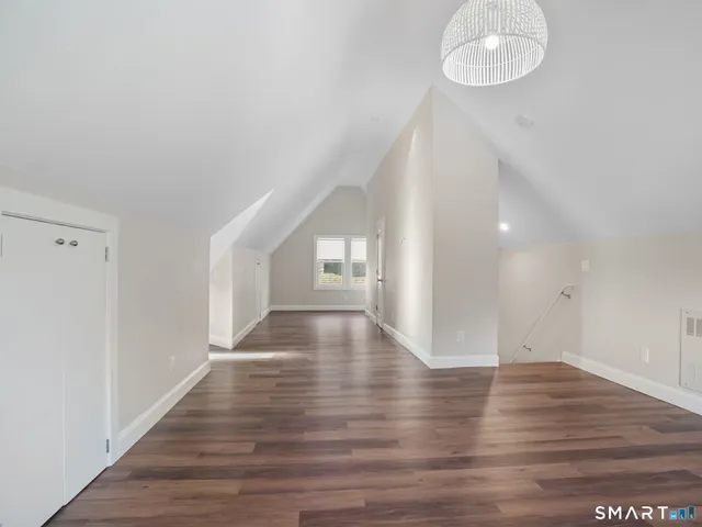 a bathroom with a shower sink and mirror