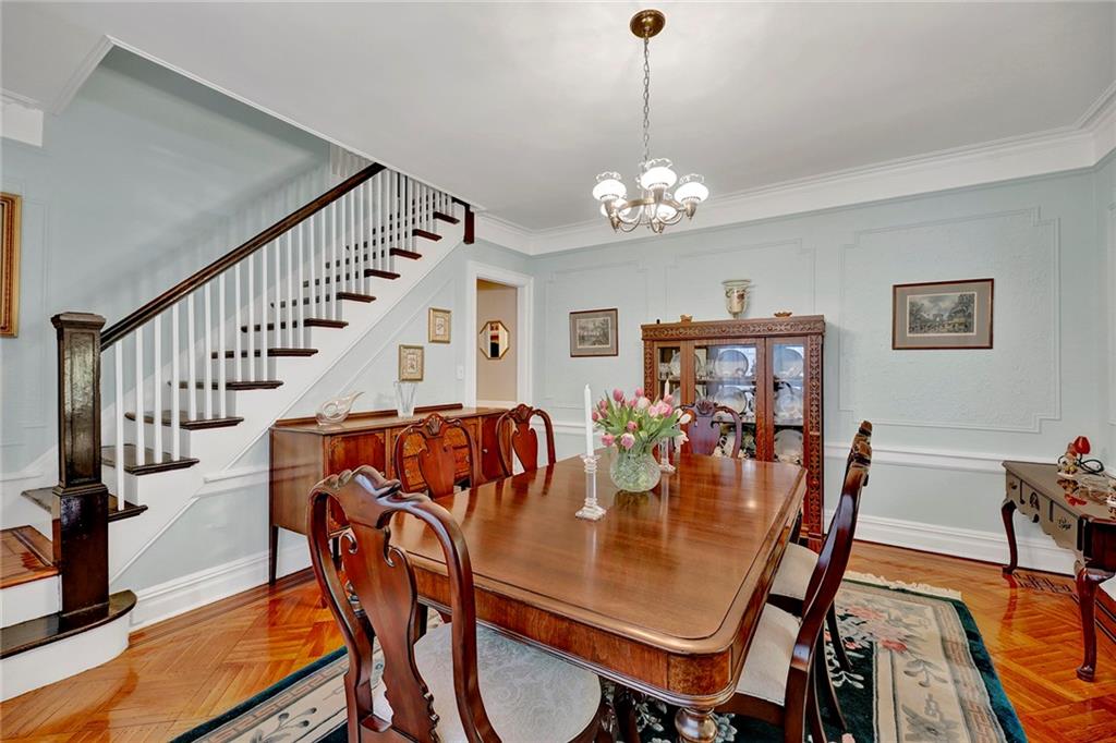 7607 Colonial Road Brooklyn, NY 11209 - Photo 13 of 35 a view of a dining room with furniture wooden floor and chandelier