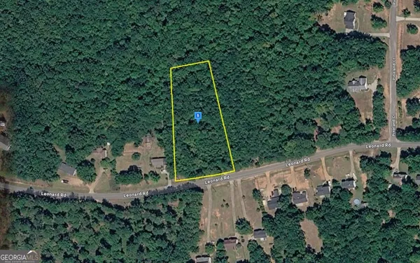 an aerial view of house with yard