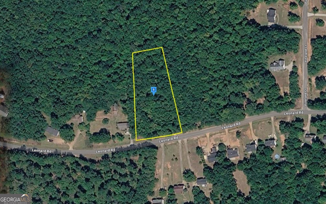 an aerial view of house with yard