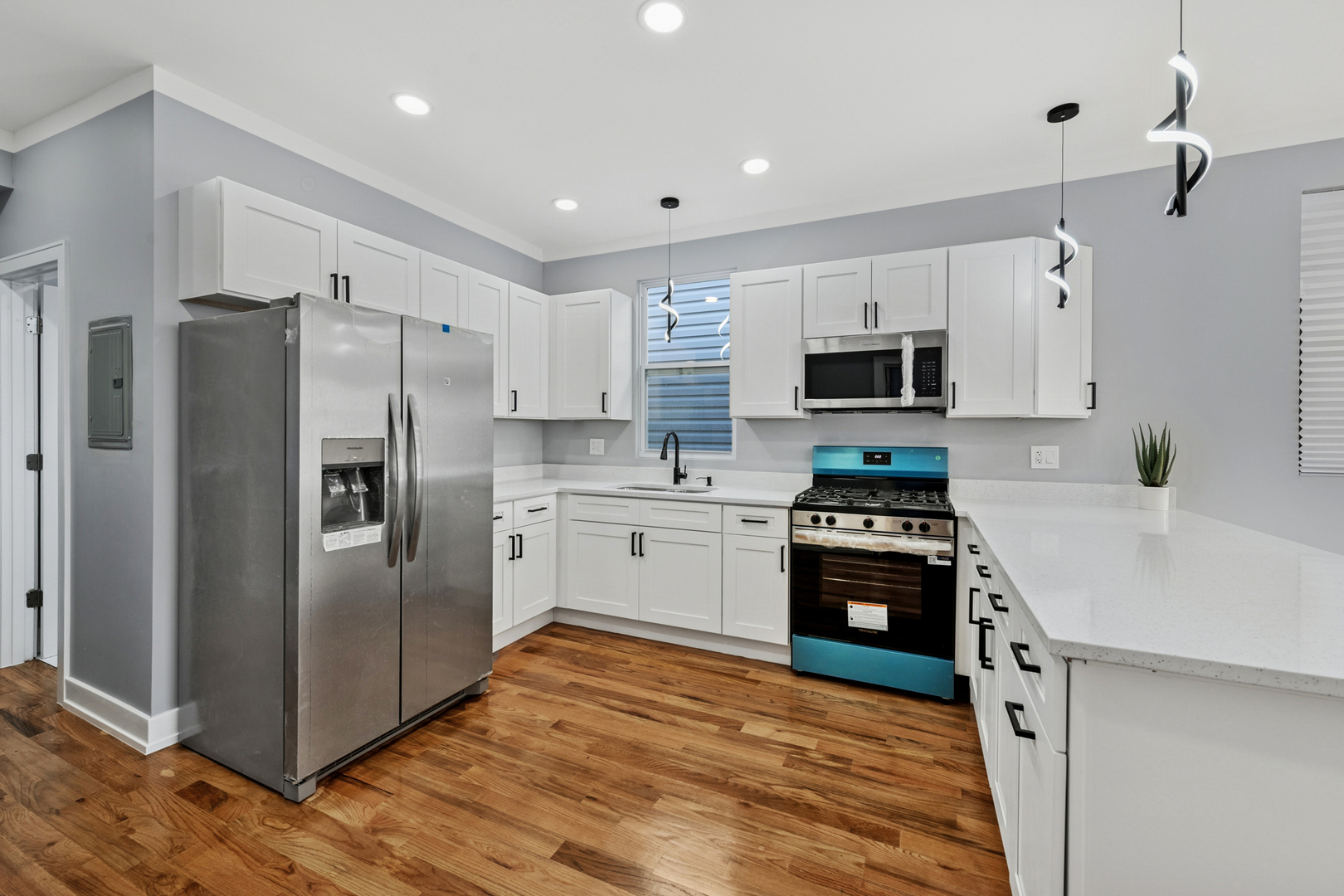 2536 West 46th Street Chicago, IL 60632 - Photo 11 of 21 a kitchen with stainless steel appliances a refrigerator stove microwave and sink