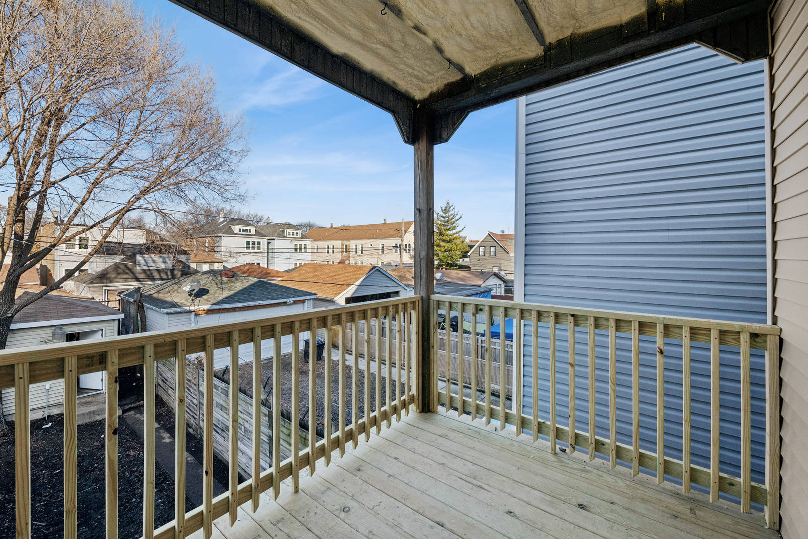 2536 West 46th Street Chicago, IL 60632 - Photo 17 of 21 a view of a balcony with wooden floor and fence