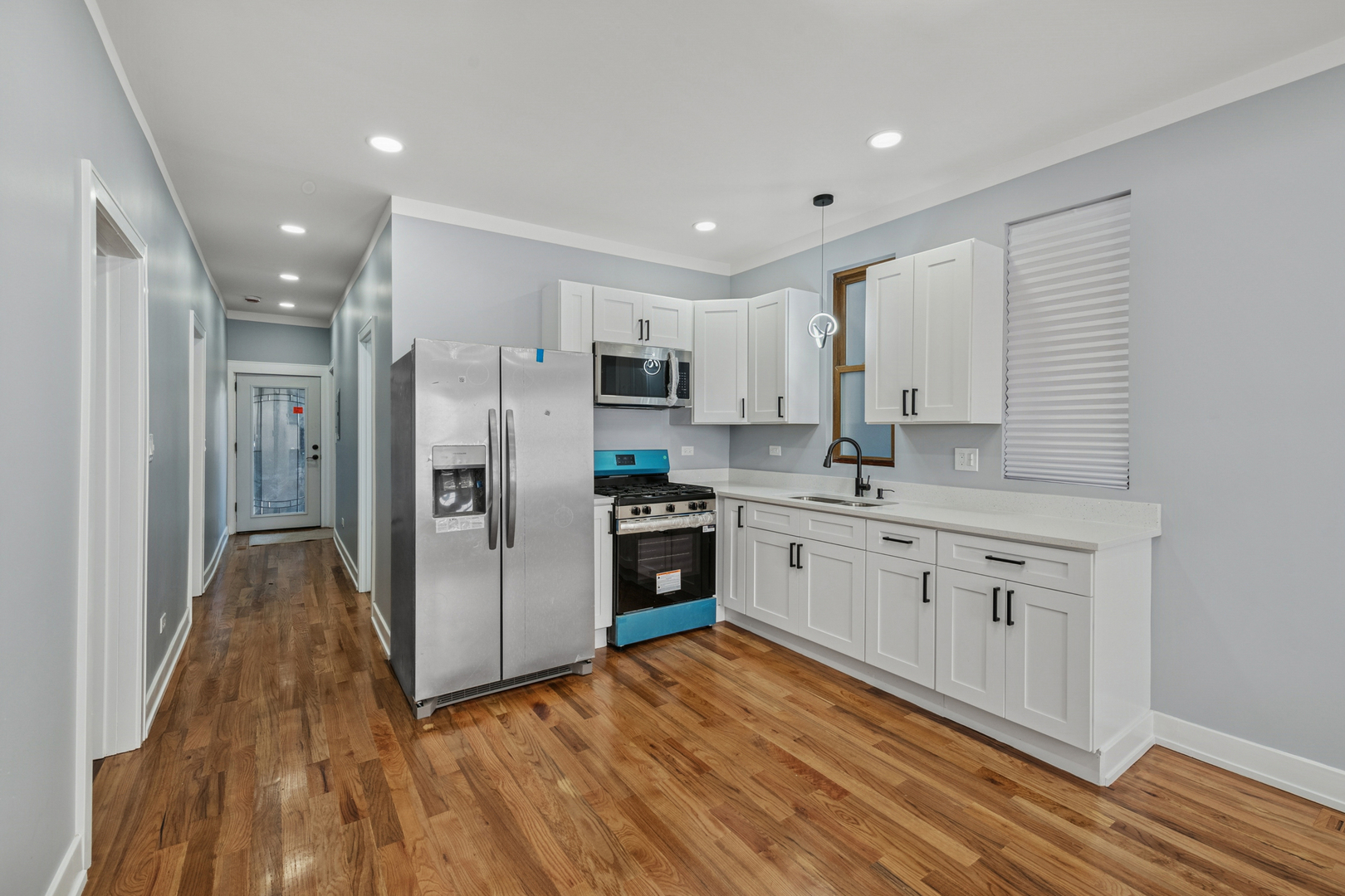 2536 West 46th Street Chicago, IL 60632 - Photo 3 of 21 a kitchen with stainless steel appliances a refrigerator sink and cabinets