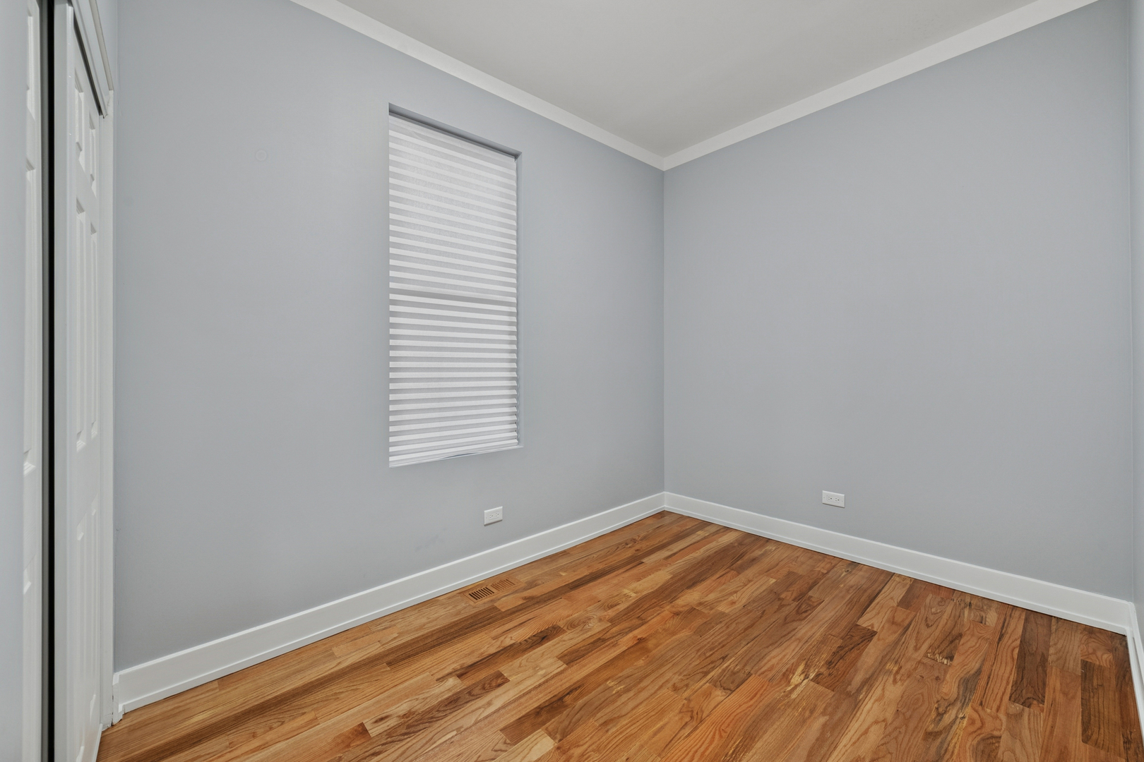 2536 West 46th Street Chicago, IL 60632 - Photo 6 of 21 a view of a room with wooden floor and a window