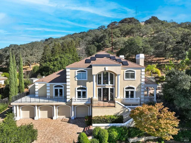 a aerial view of a house with a yard
