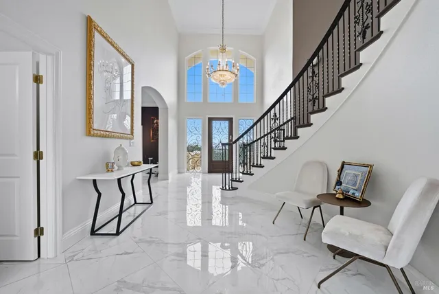 a view of a dining room with furniture and window