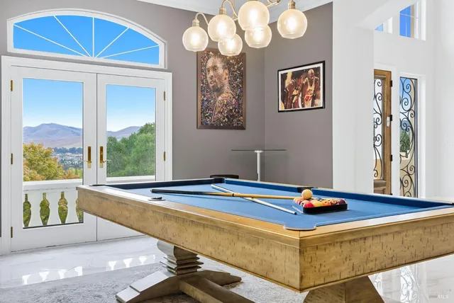 a kitchen with stainless steel appliances granite countertop a stove a sink and a granite counter tops