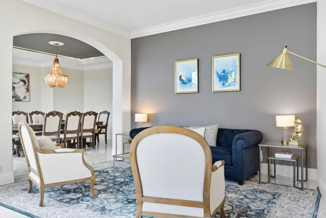 a dining room with furniture and window