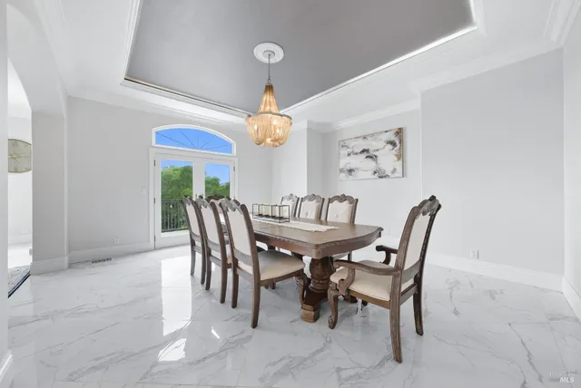 a bedroom with furniture and a flat screen tv