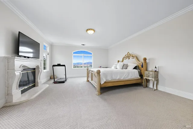 an aerial view of a house with a mountain in the background
