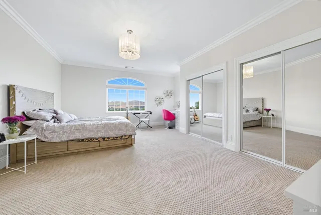 an aerial view of a house with a big yard