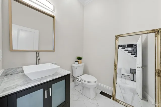 an aerial view of a house with backyard