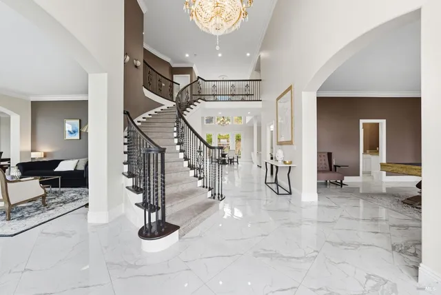 a room with pool table and windows