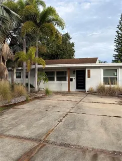 front view of a house with a trees