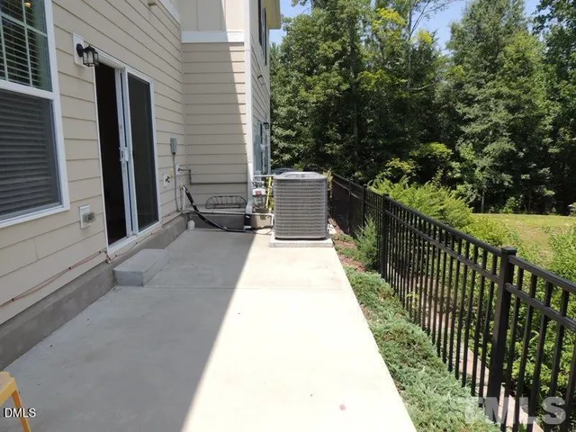 a view of a balcony with wooden floor