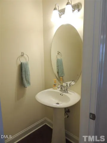a bathroom with a sink and mirror