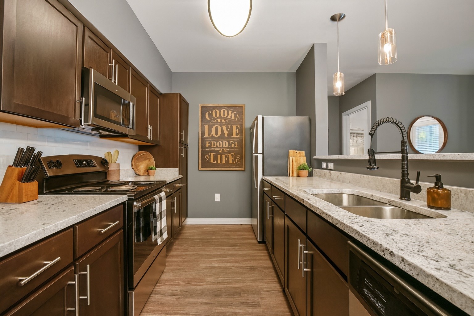414 Rosedale Avenue, Unit 308 Nashville, TN 37211 - Photo 13 of 26 a kitchen with stainless steel appliances granite countertop a sink and cabinets