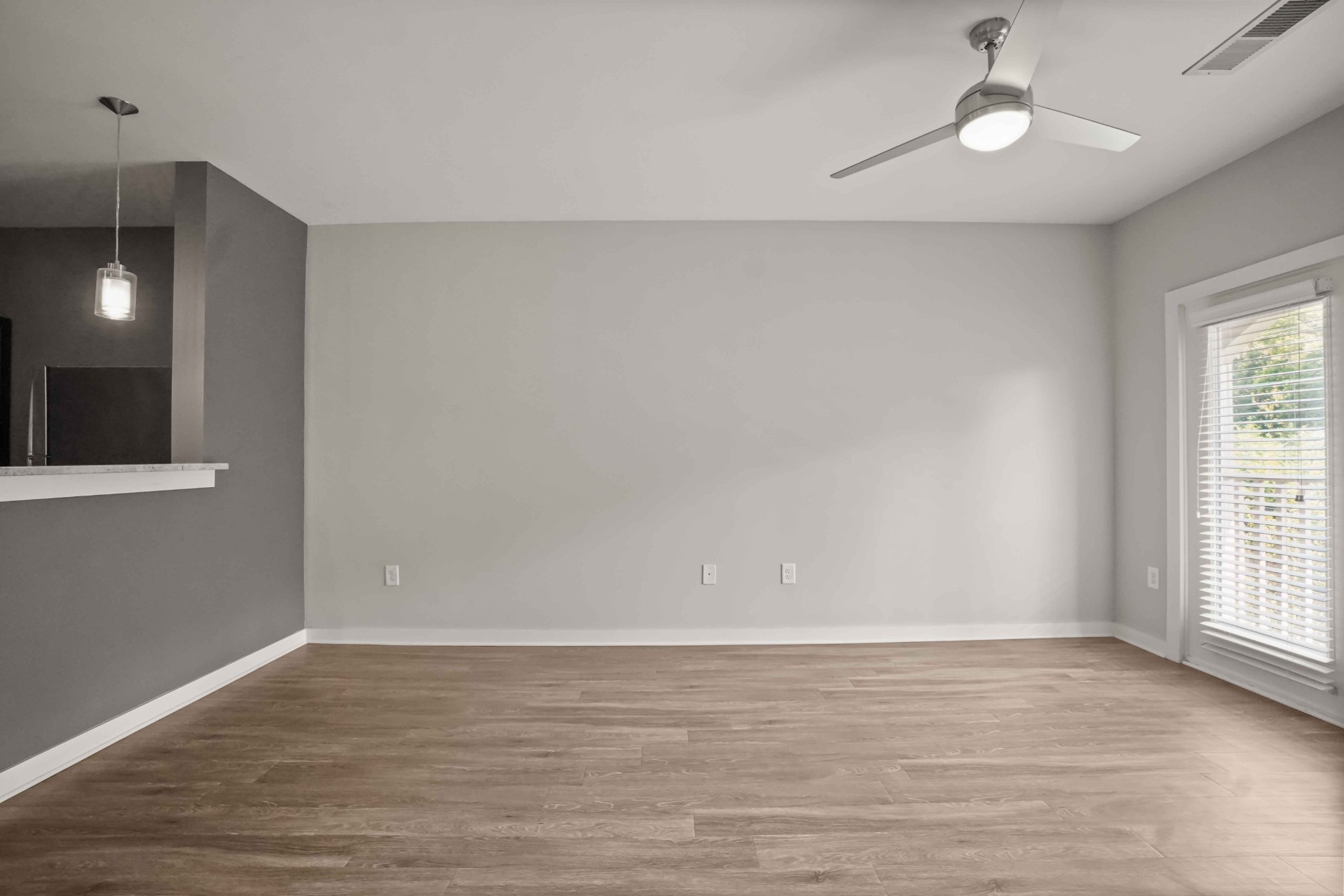 414 Rosedale Avenue, Unit 308 Nashville, TN 37211 - Photo 7 of 26 wooden floor in an empty room with a window