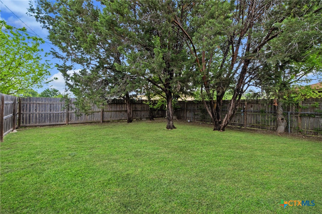 1803 Aztec Trace Harker Heights, TX 76548 - Photo 26 of 42 a view of a backyard with a trees