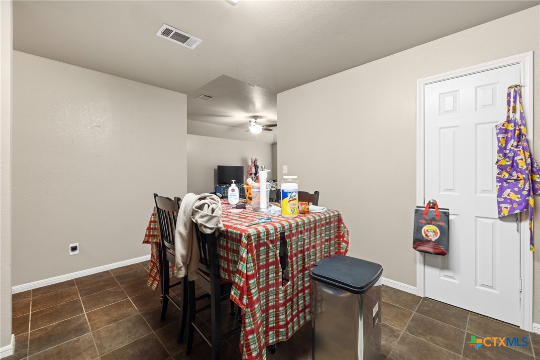 1803 Aztec Trace Harker Heights, TX 76548 - Photo 35 of 42 a bedroom with a bed and a table in it