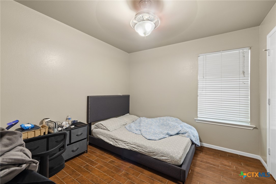 1803 Aztec Trace Harker Heights, TX 76548 - Photo 37 of 42 a bedroom with a bed and a window