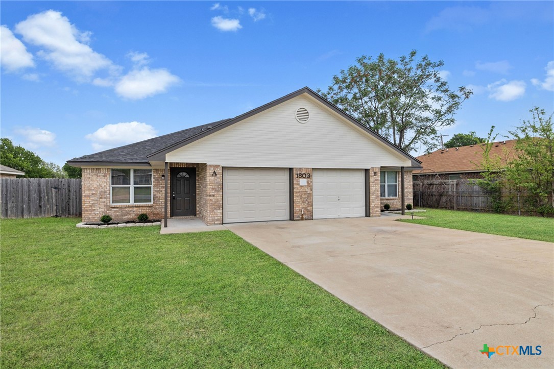 1803 Aztec Trace Harker Heights, TX 76548 - Photo 4 of 42 a view of a yard in front of a house with large tree