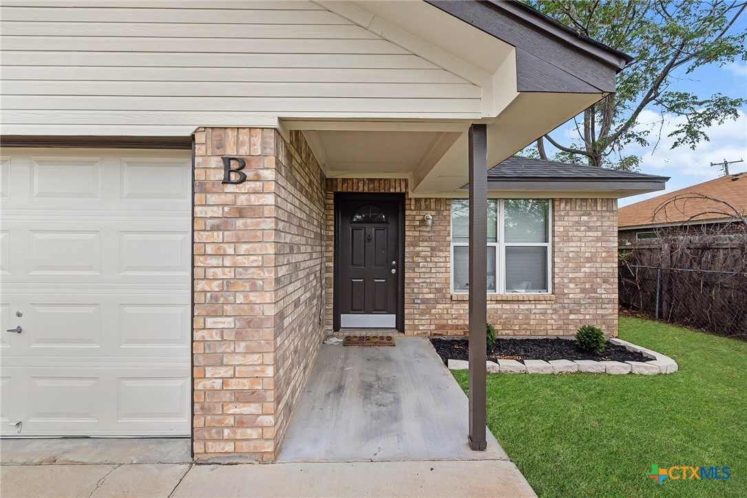 1803 Aztec Trace Harker Heights, TX 76548 - Photo 5 of 42 a front view of a house with a garden