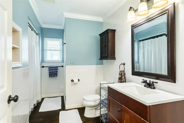 a view of a house with a yard balcony and sitting area