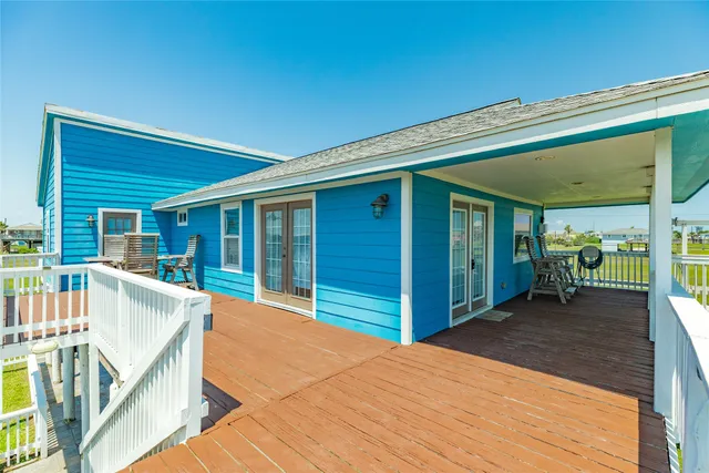a view of a patio with table and chairs
