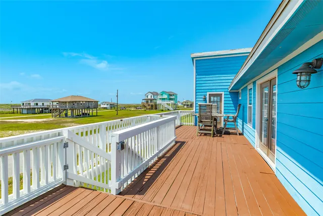 a view of a balcony with chairs