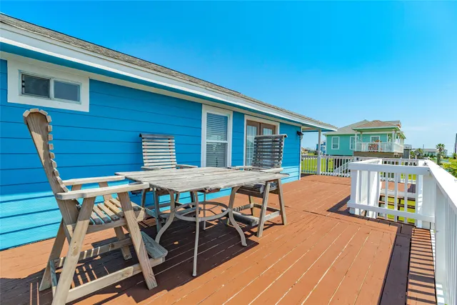 a view of a balcony with wooden floor and stairs