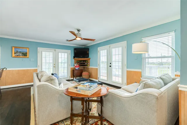 a kitchen with appliances a table chairs sink and cabinets
