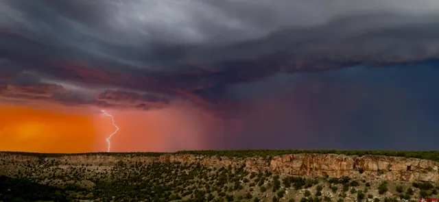 a view of a yard with mountain and mountains in the background