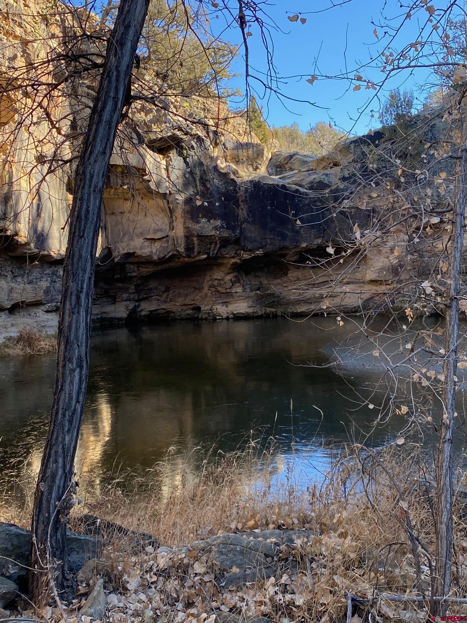0 County Road 40.2, Unit POITRY CANYON RANCH Branson, CO 81027 - Photo 35 of 45 a water view of water with a house