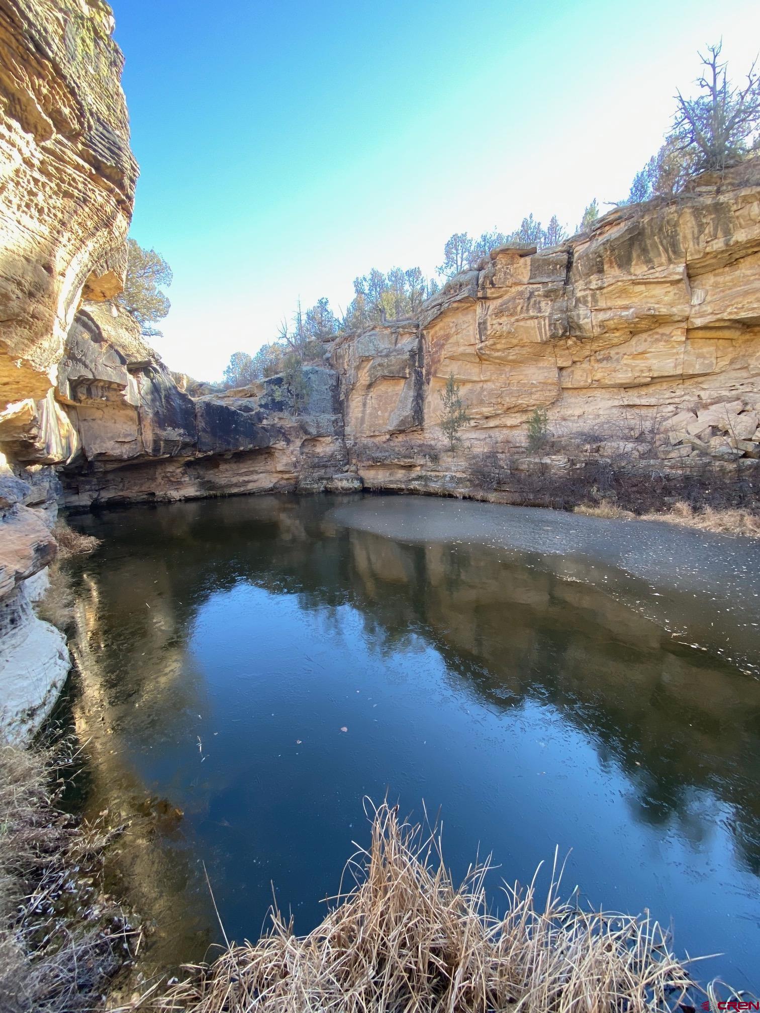 0 County Road 40.2, Unit POITRY CANYON RANCH Branson, CO 81027 - Photo 37 of 45 a view of a lake with houses
