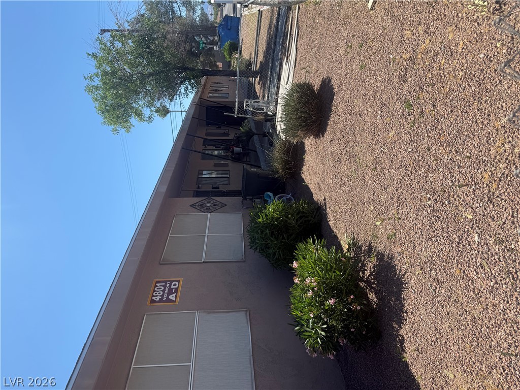 521 North Decatur Boulevard, Unit B Las Vegas, NV 89107 - Photo 1 of 17 A modest apartment building presents a tidy facade with desert-friendly landscaping.