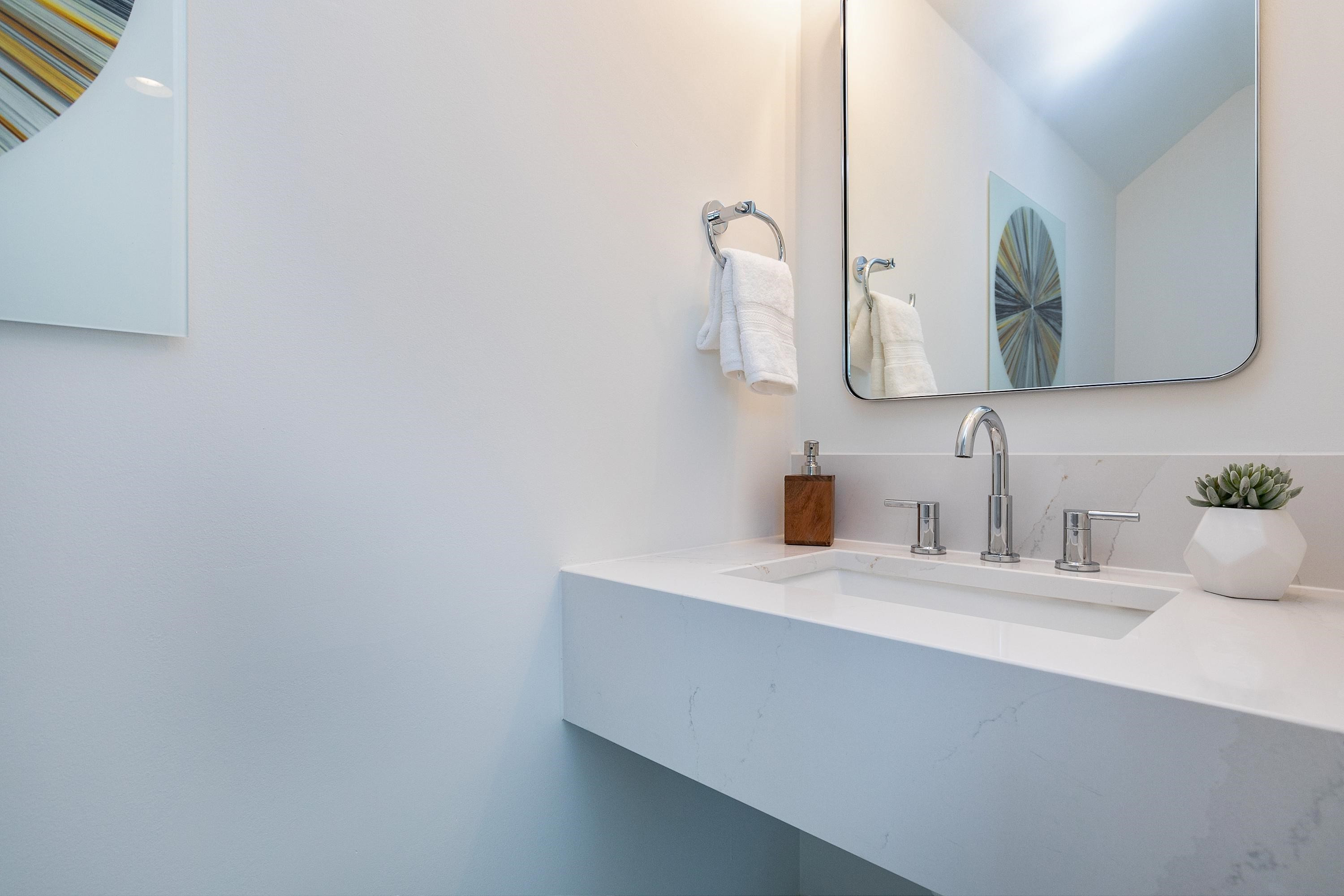 118 Summit Avenue Raleigh, NC 27603 - Photo 26 of 30 a bathroom with a sink vanity and a mirror
