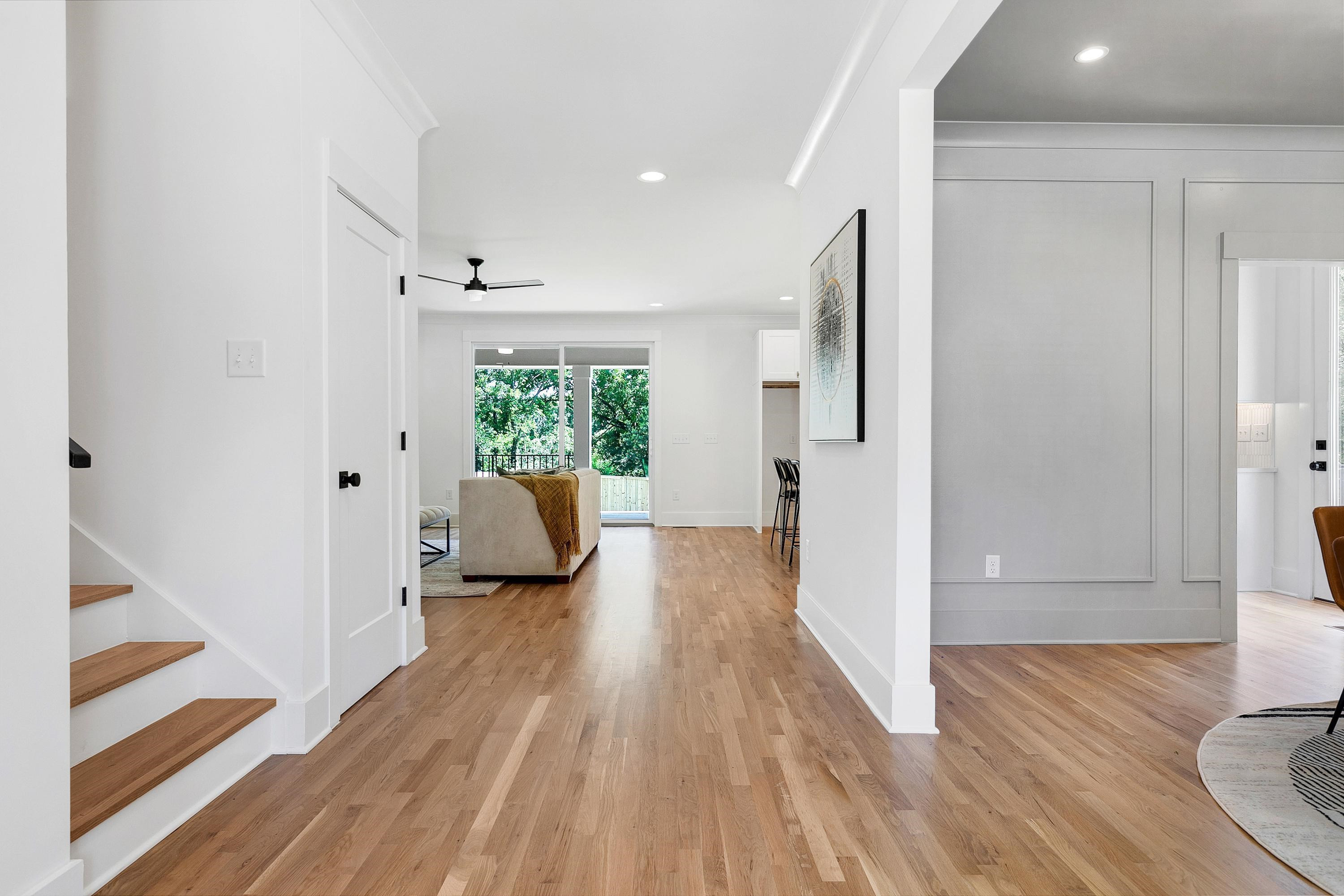 118 Summit Avenue Raleigh, NC 27603 - Photo 5 of 30 a view of a hallway with wooden floor and glass door