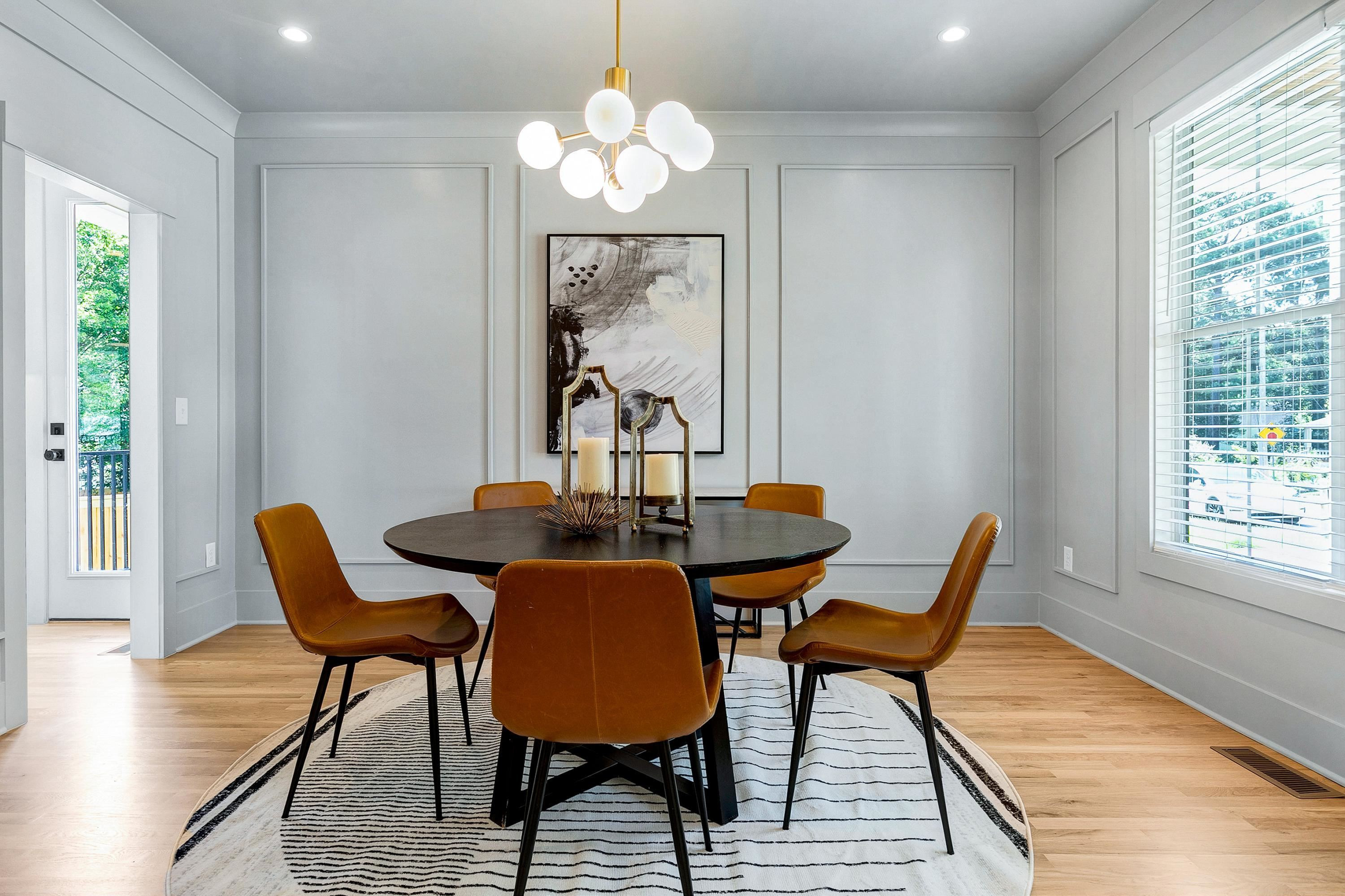 118 Summit Avenue Raleigh, NC 27603 - Photo 6 of 30 a view of a dining room with furniture wooden floor and chandelier