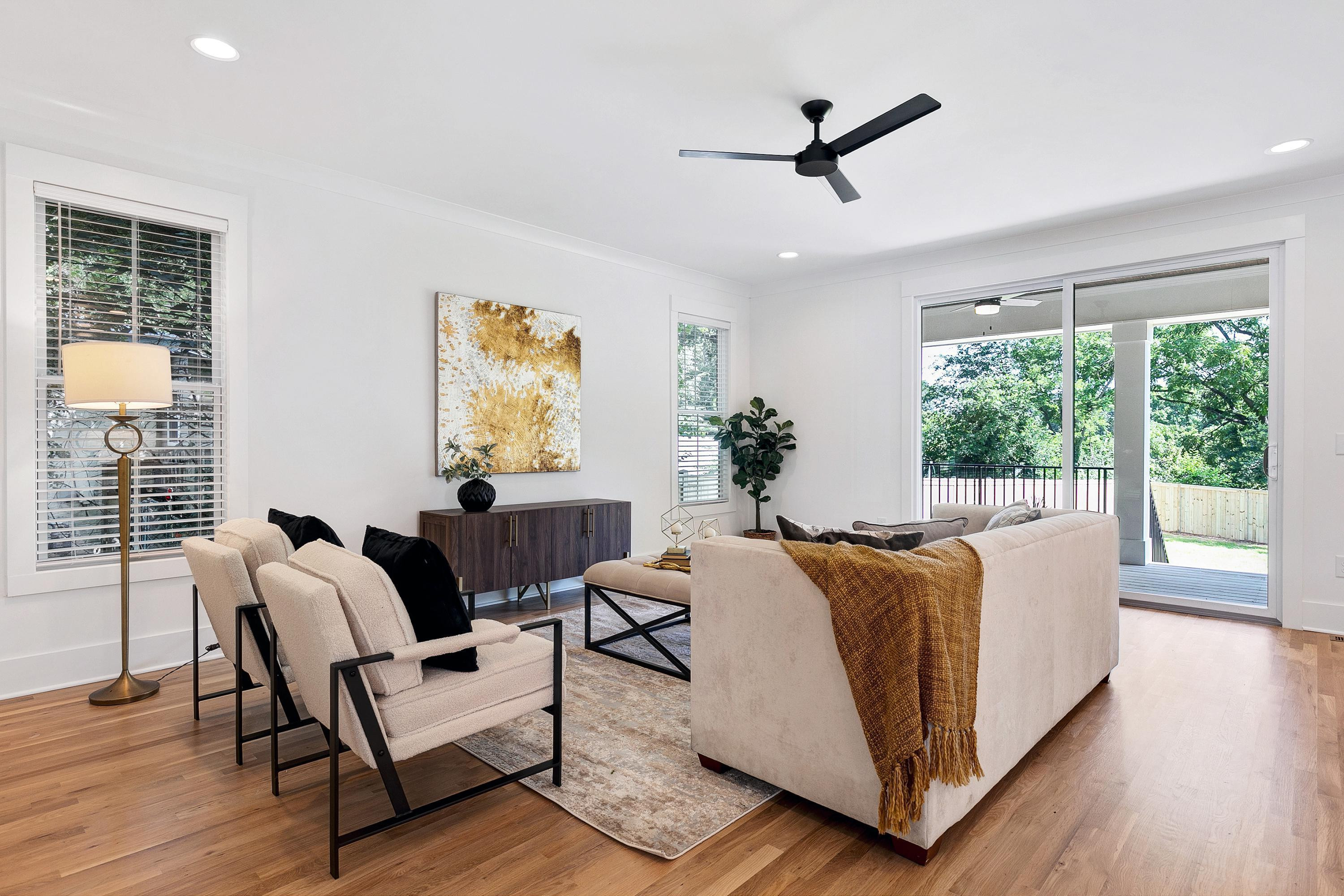 118 Summit Avenue Raleigh, NC 27603 - Photo 7 of 30 a living room with furniture and a large window