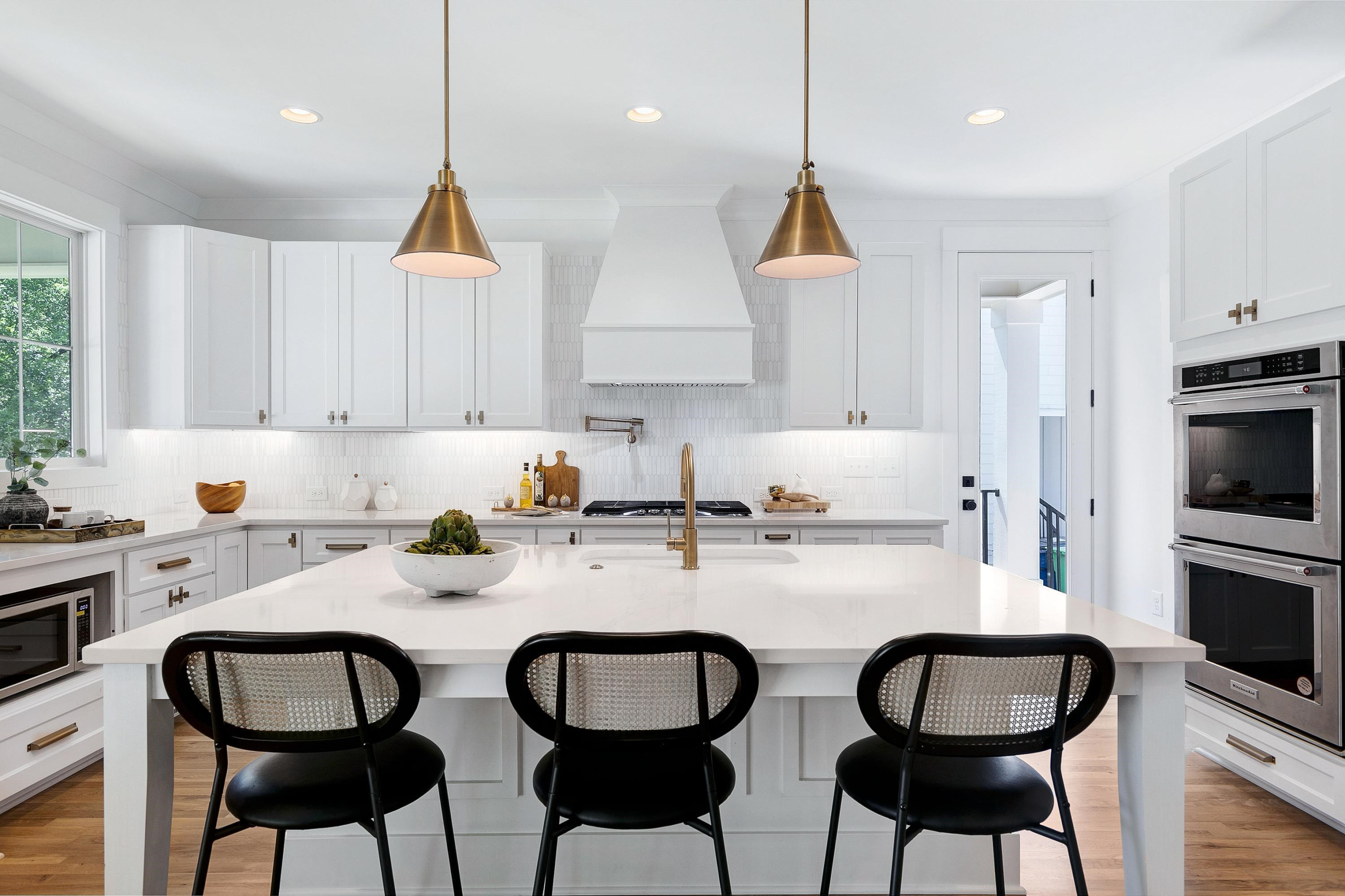 118 Summit Avenue Raleigh, NC 27603 - Photo 9 of 30 a kitchen with granite countertop a dining table chairs and cabinets