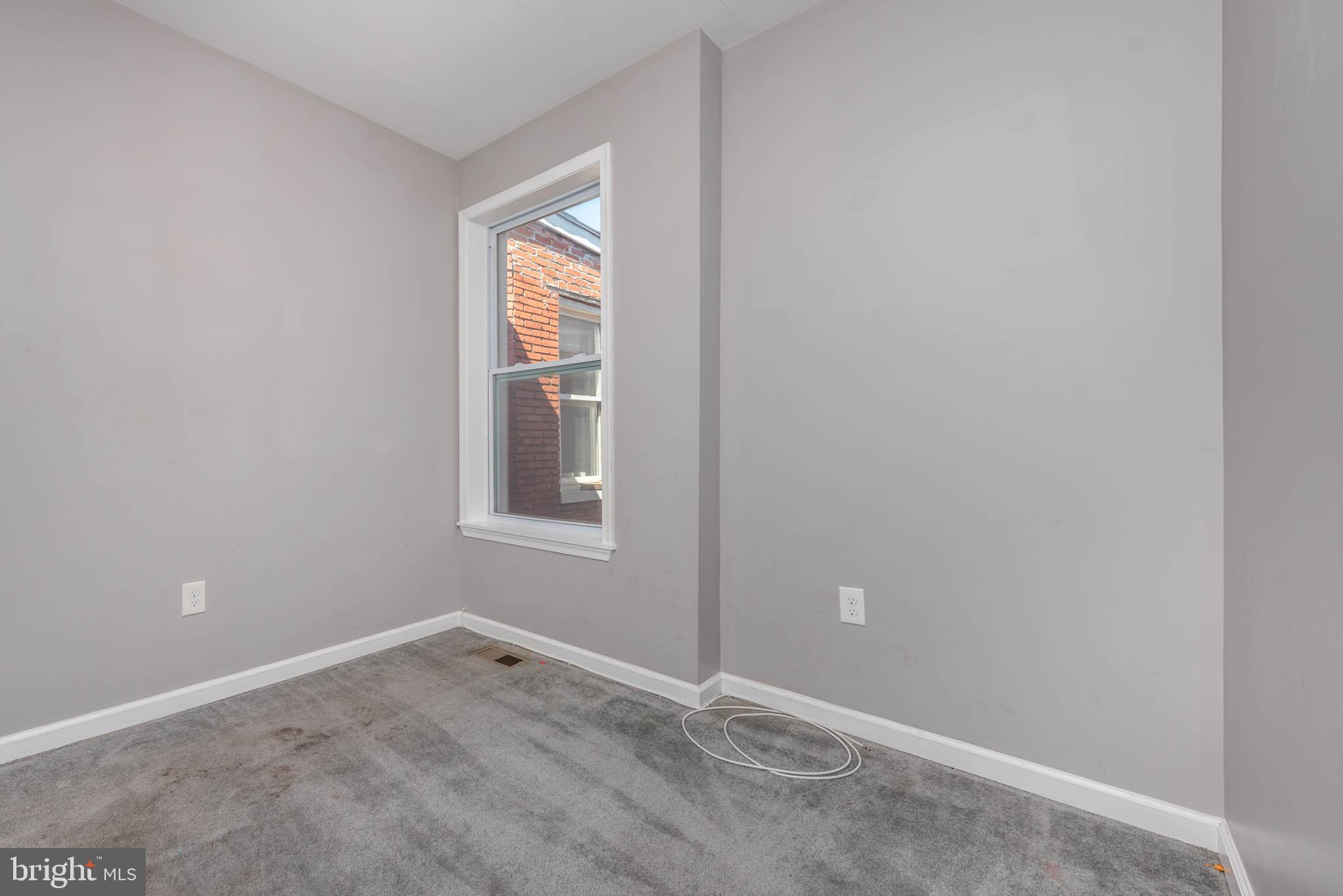 2118 East Hoffman Street Baltimore, MD 21213 - Photo 13 of 19 a view of empty room with window