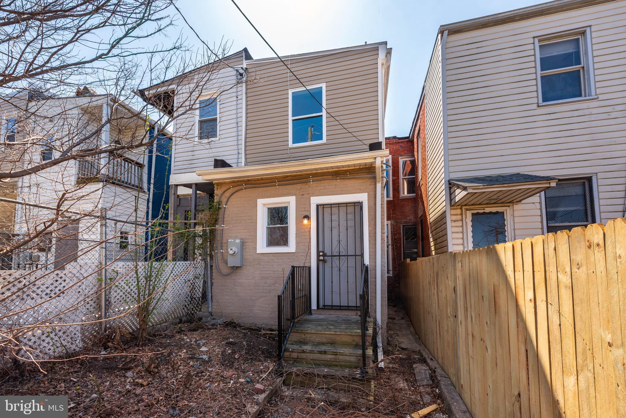 2118 East Hoffman Street Baltimore, MD 21213 - Photo 17 of 19 a view of a house with a yard