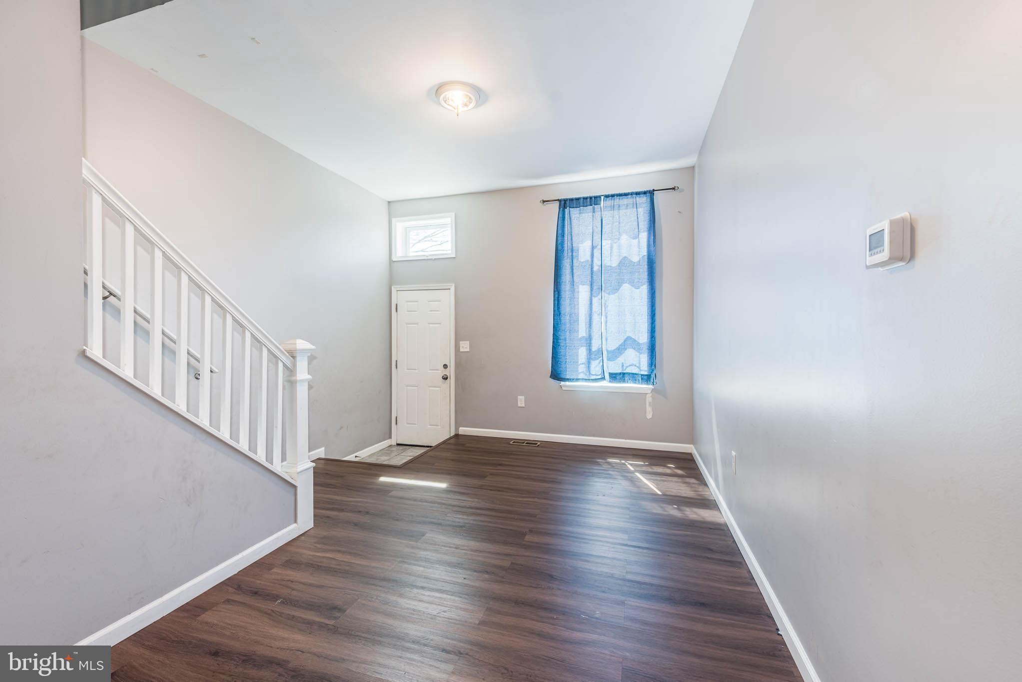 2118 East Hoffman Street Baltimore, MD 21213 - Photo 4 of 19 a view of an entryway with wooden floor
