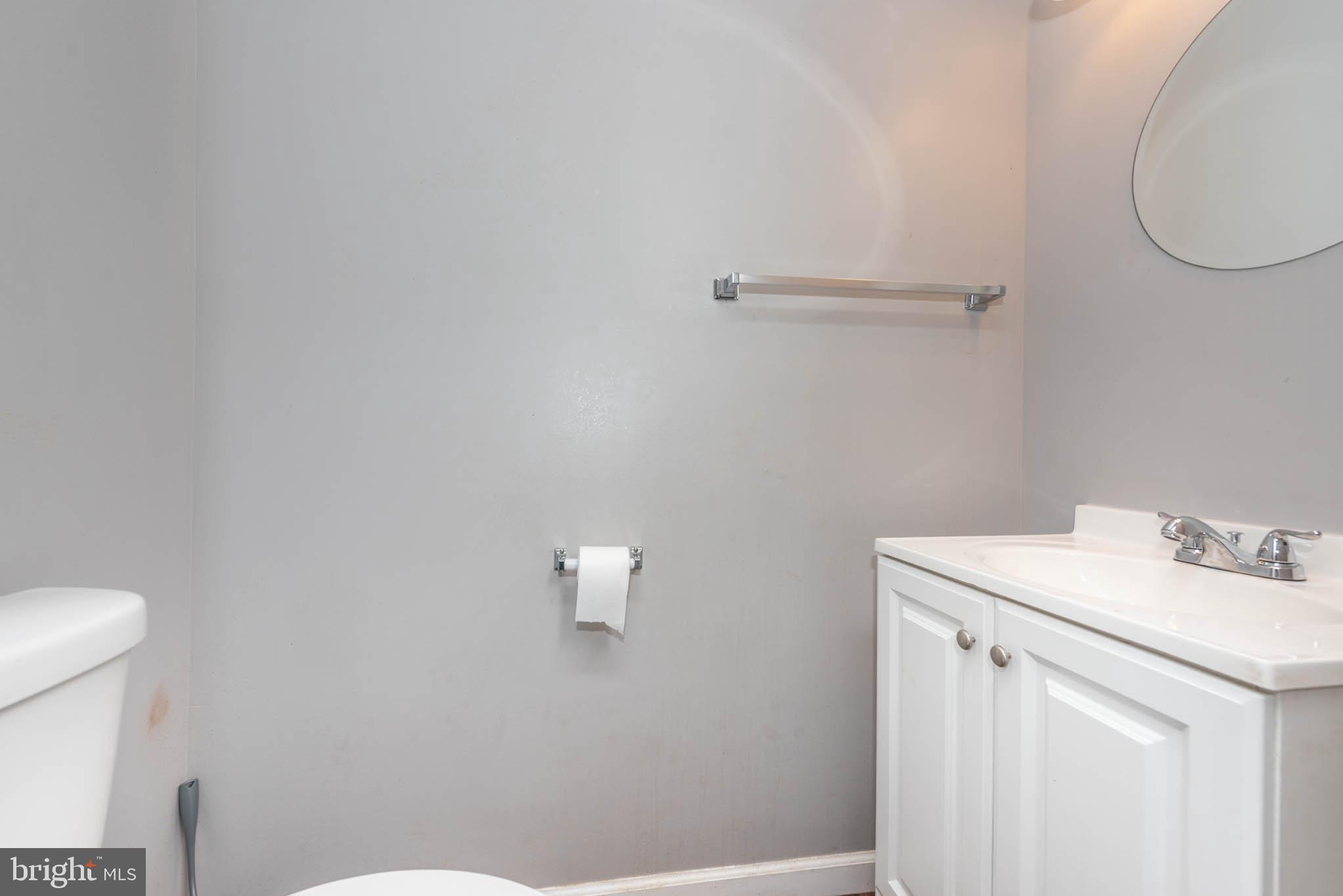 2118 East Hoffman Street Baltimore, MD 21213 - Photo 7 of 19 a bathroom with a sink and a toilet