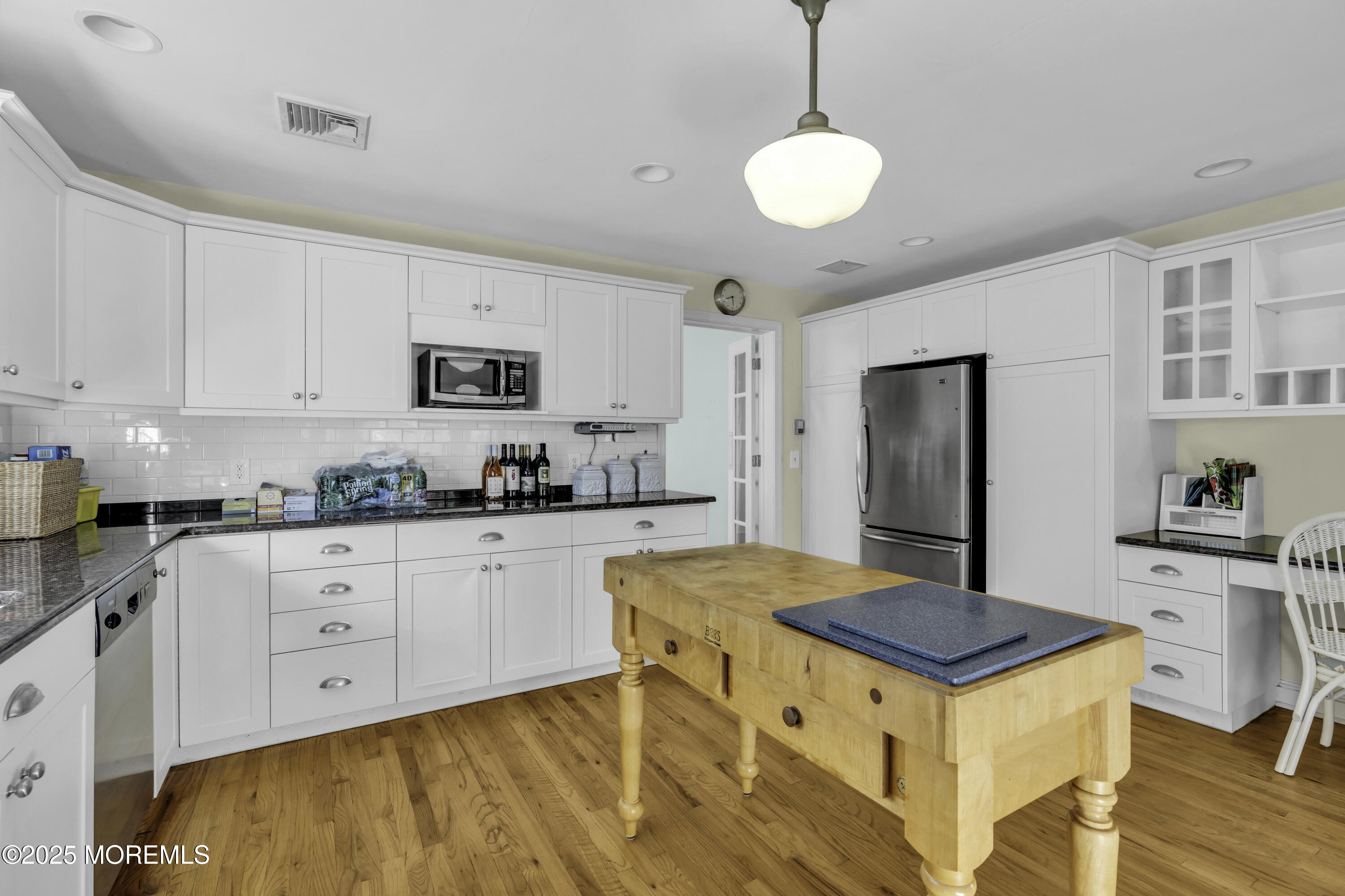 326 South Boulevard Spring Lake, NJ 07762 - Photo 18 of 54 a kitchen with a stove a sink dishwasher a refrigerator with white cabinets and wooden floor