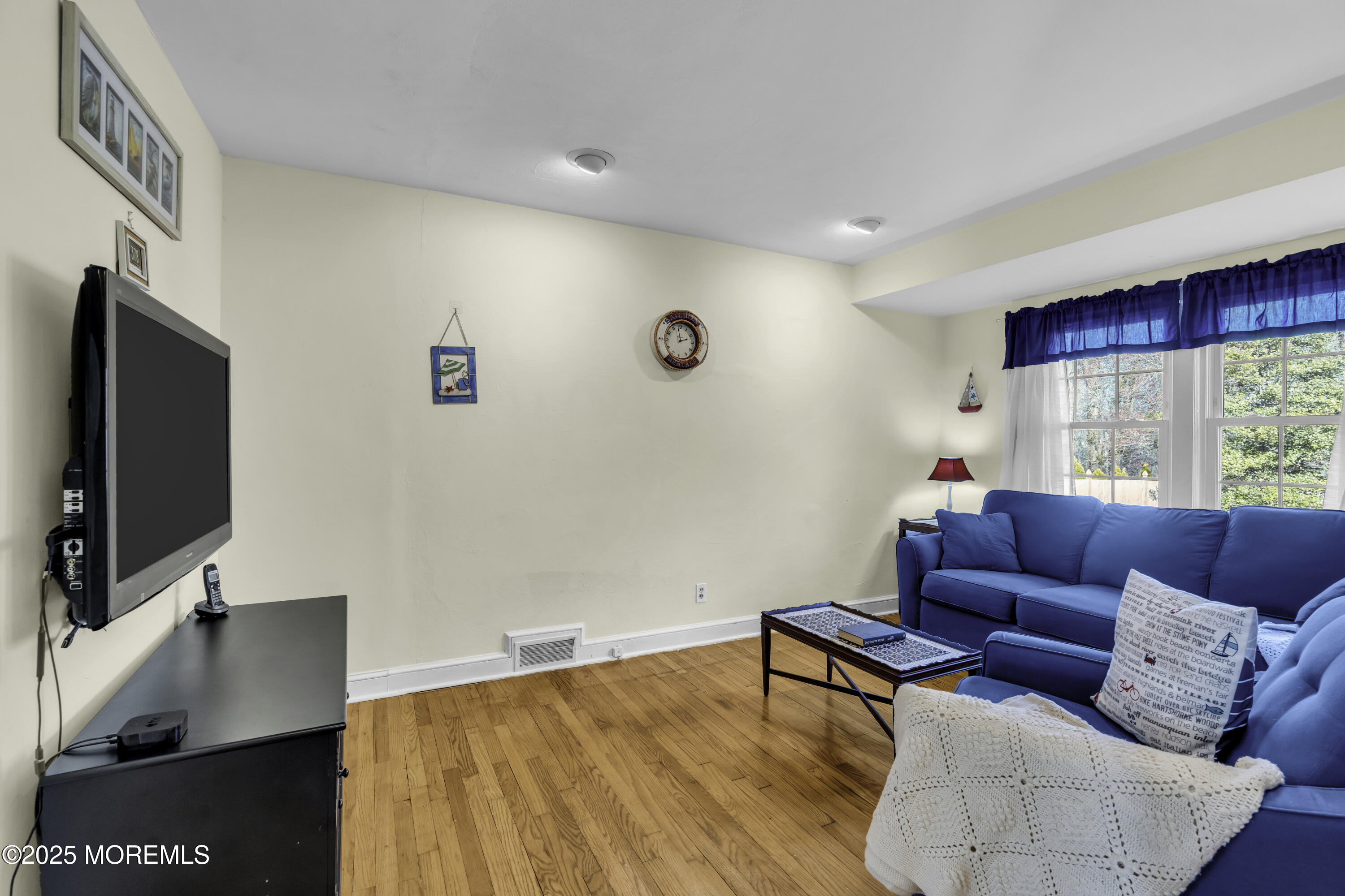326 South Boulevard Spring Lake, NJ 07762 - Photo 24 of 54 a living room with furniture and a flat screen tv