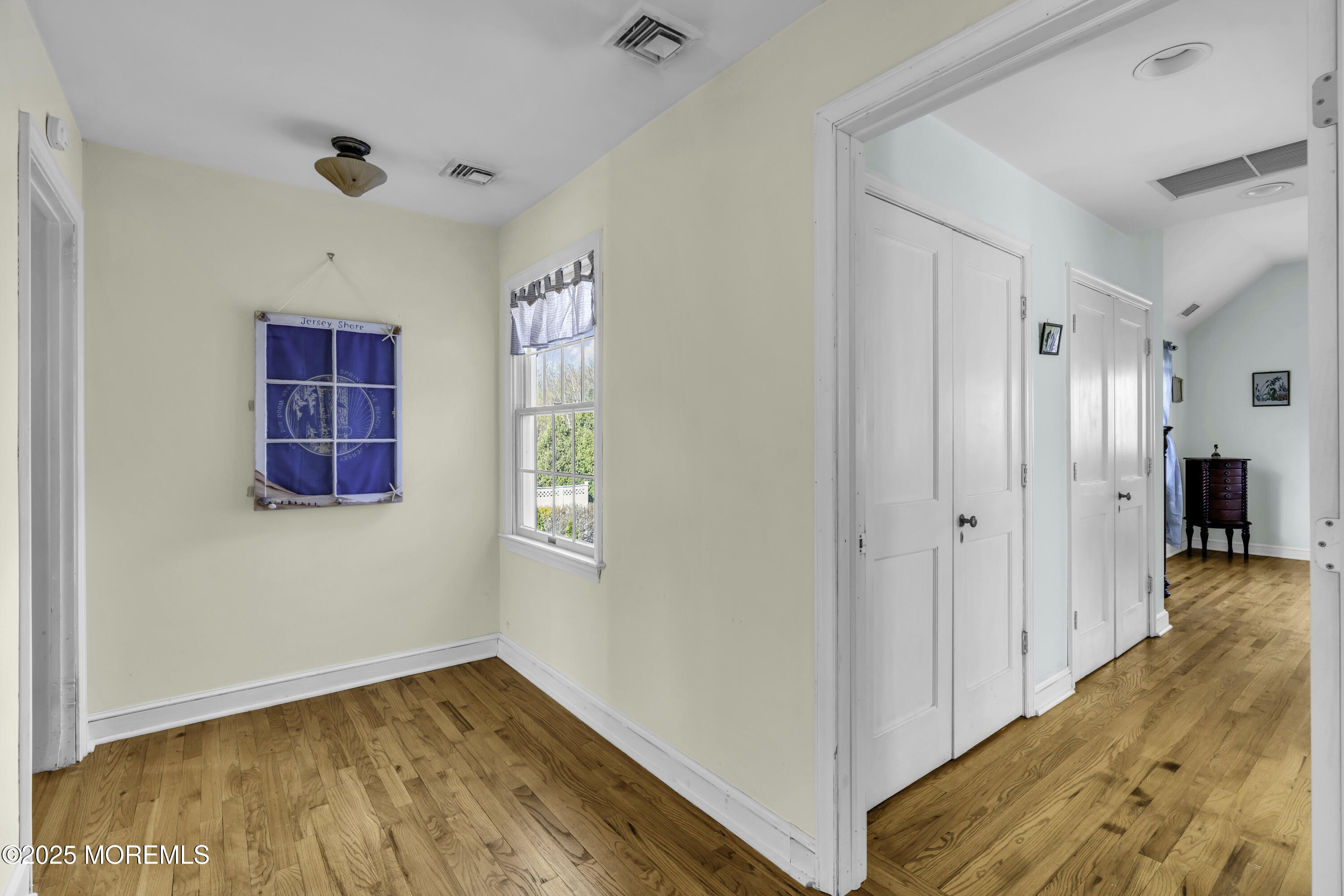 326 South Boulevard Spring Lake, NJ 07762 - Photo 36 of 54 a view of hallway with wooden floor and cabinet